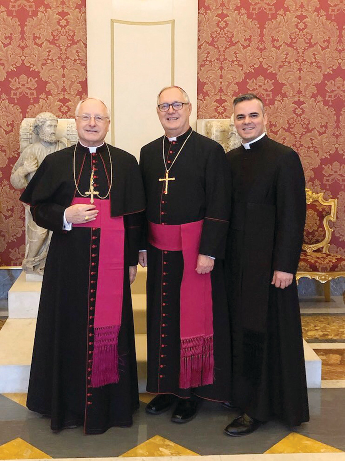 From left, Auxiliary Bishop Robert C. Evans, Bishop Thomas J. Tobin and Administrative Secretary Father Jeremy Rodrigues at the Apostolic Palace just before meeting the Holy Father.